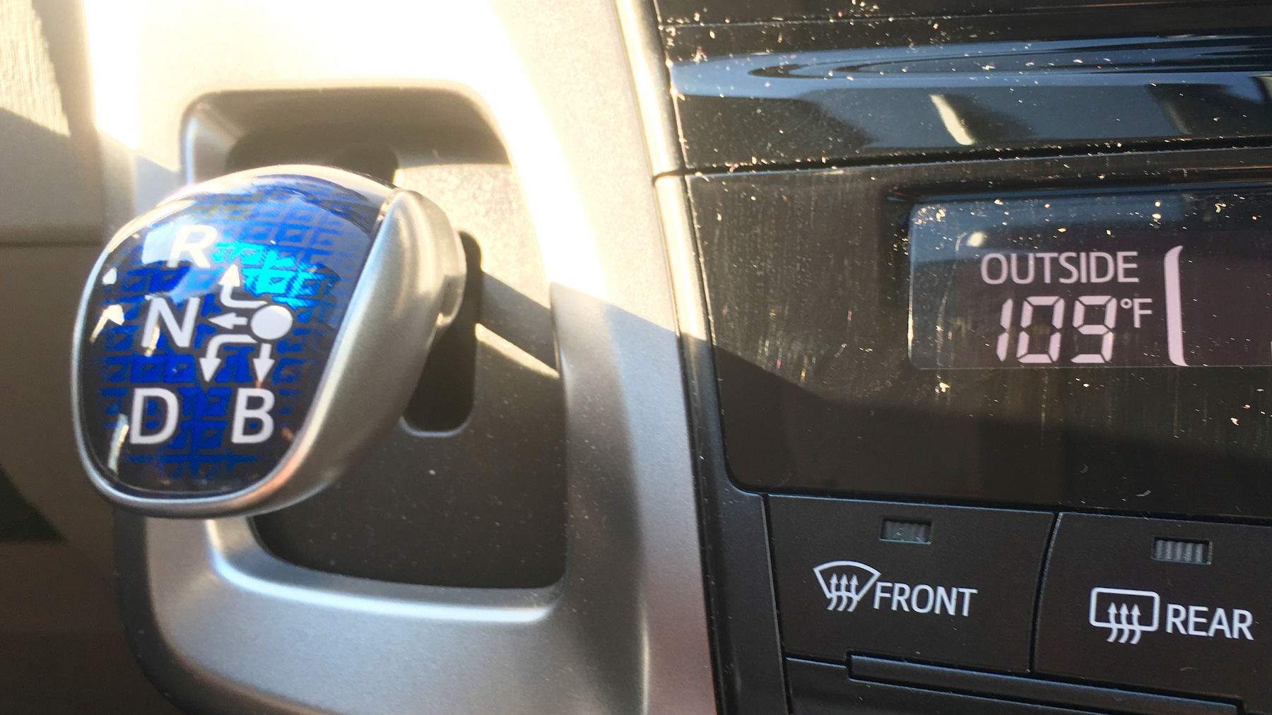 The Prius shifter is unapologetically a joystick. And yes, Phoenix, AZ gets a bit toasty in the summer.